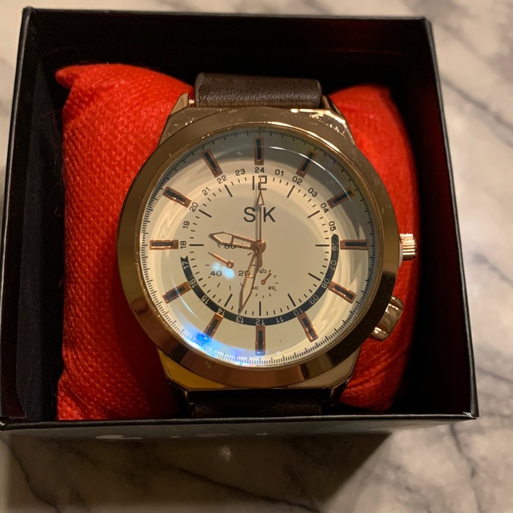 Rose gold and brown band men’s watch